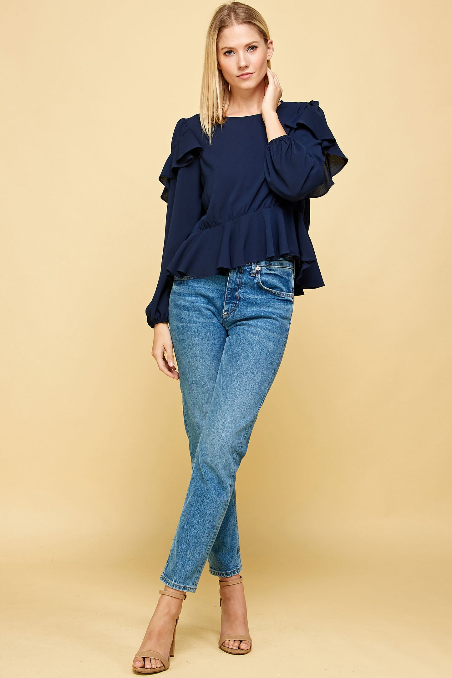 RUFFLED DETAIL PEPLUM TOP IN NAVY