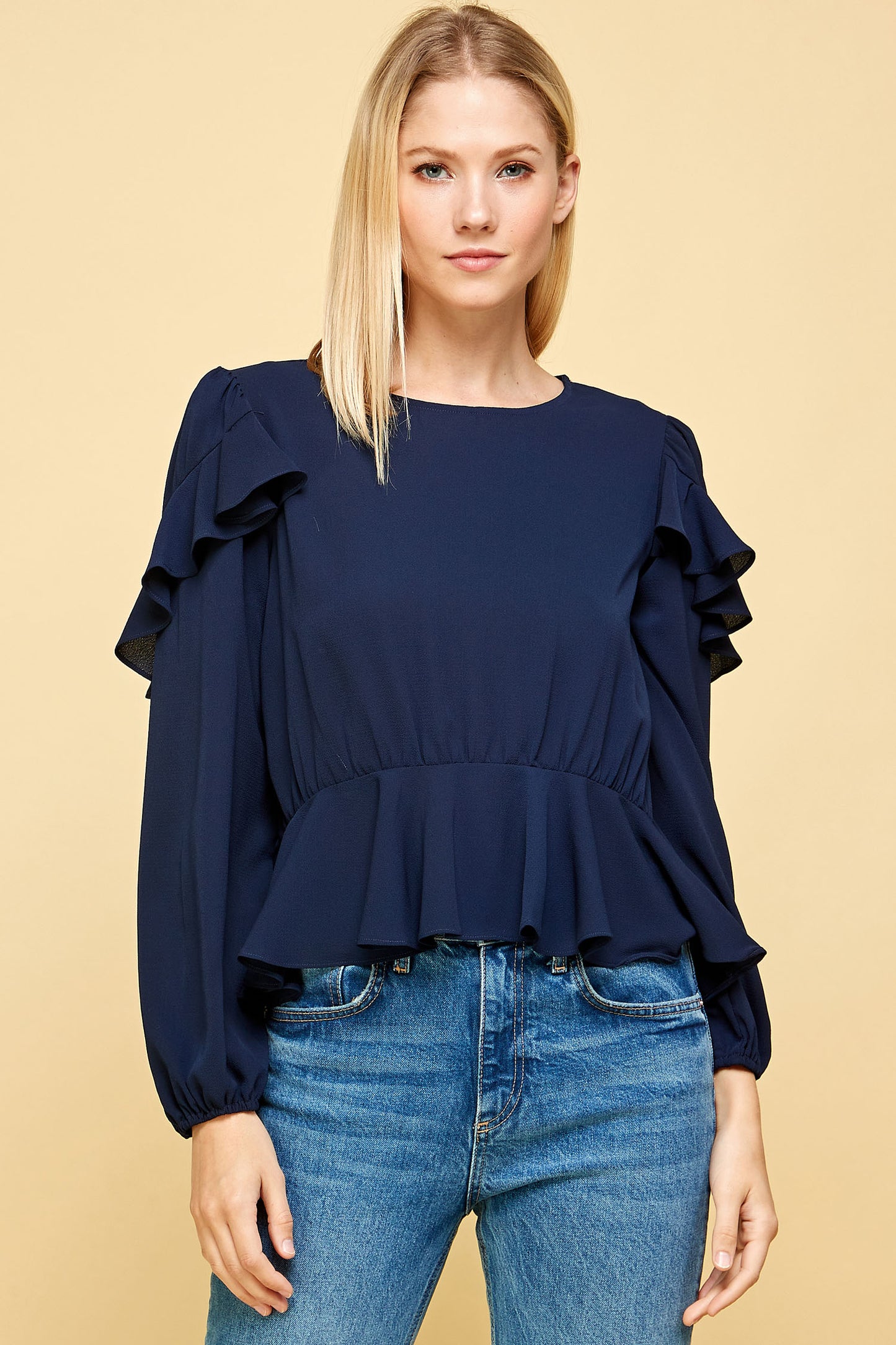 RUFFLED DETAIL PEPLUM TOP IN NAVY