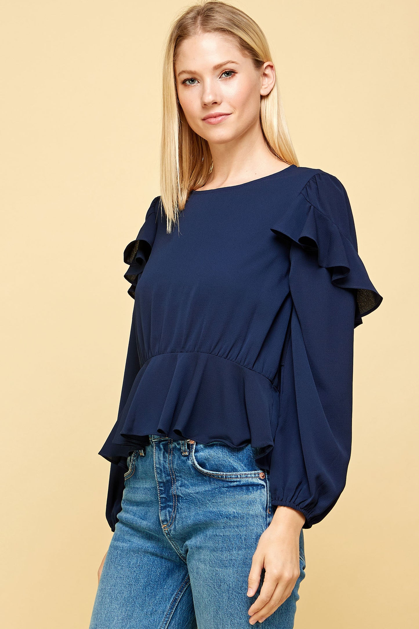 RUFFLED DETAIL PEPLUM TOP IN NAVY