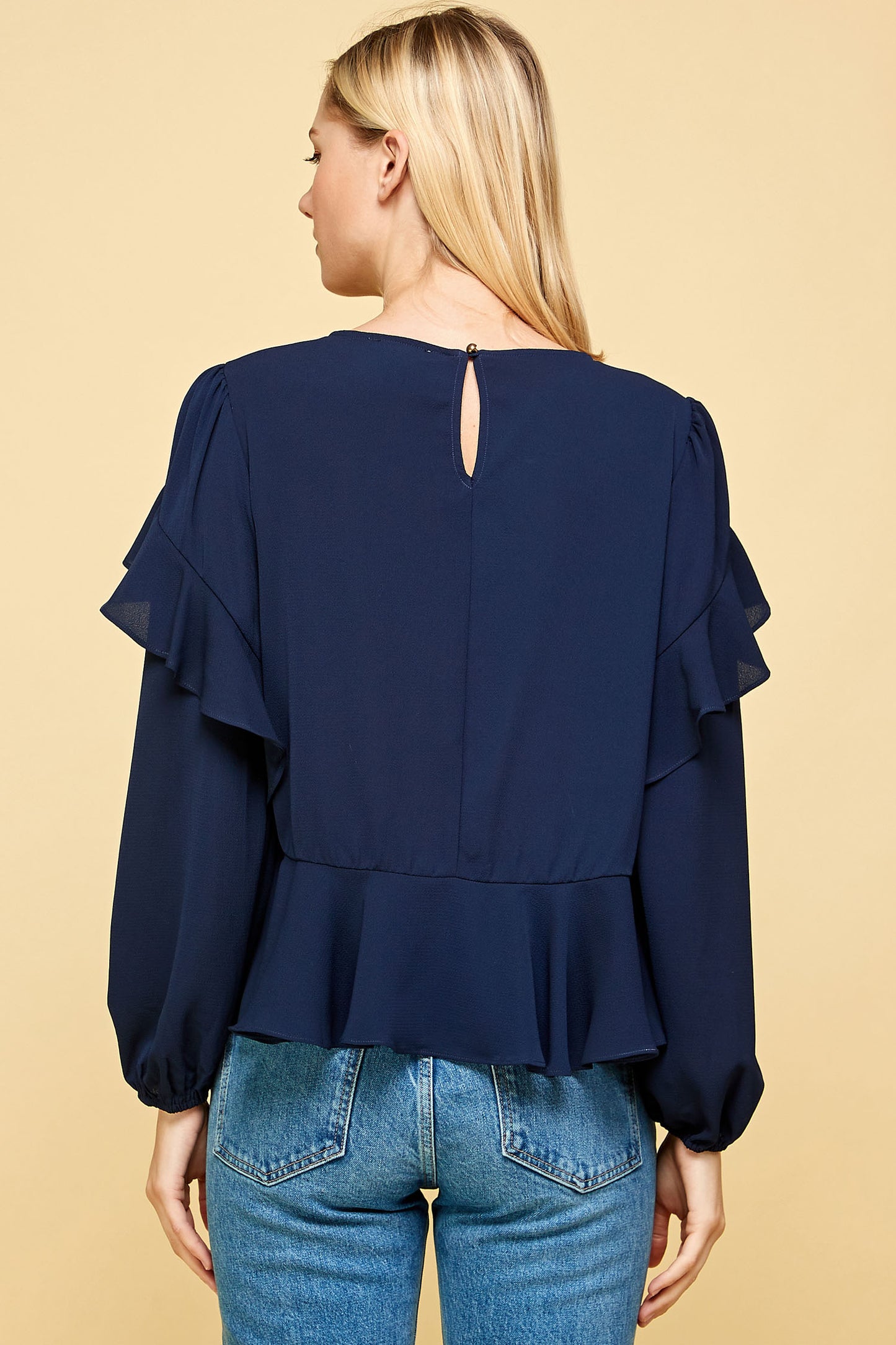 RUFFLED DETAIL PEPLUM TOP IN NAVY