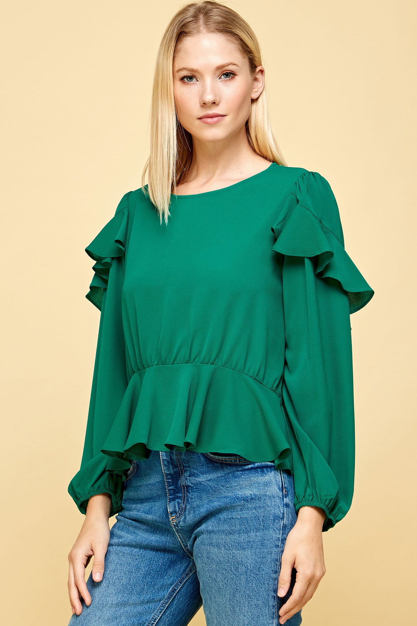 RUFFLED DETAIL PEPLUM TOP IN NAVY